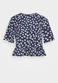 Floral peplum top with short sleeves, navy background, white and red flowers, round neckline, and subtle ruffle at the hem.