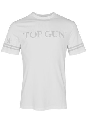 Hvid bomulds t-shirt med "TOP GUN" i grå, korte ærmer med grå stjerner og stribe detaljer på skulderen. Glat tekstur.