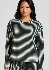 Gestreepte langemouwen top in donkergroen en wit, met een ronde halslijn en een losse pasvorm. Gemaakt van zachte, gestructureerde stof.