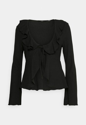 Zwarte blouse met lange mouwen en een ronde halslijn, met gerimpelde accenten bij de kraag en een strikdetail bij de taille. Gelaagde stof.