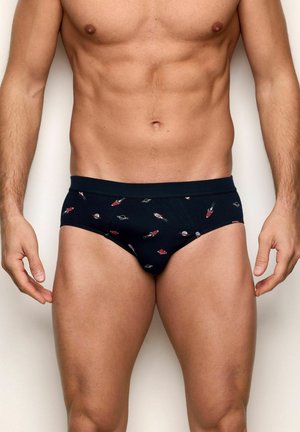 Marineblaue Slips aus weicher Baumwolle mit einem Muster aus kleinen Raketen und Kreisen. Der elastische Bund sitzt bequem auf den Hüften.