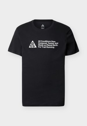 Black short-sleeve t-shirt made of cotton with a round neck, featuring white printed text and a triangle logo on the front.