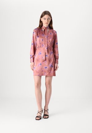 Silk dress in soft pink with purple abstract patterns, featuring a high collar, long sleeves, and a cinched waist for a tailored look.