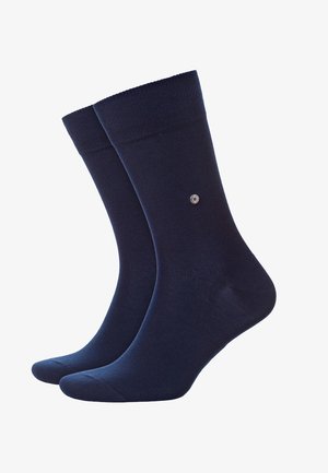Dunkelblaue Baumwollsocken mit geripptem Rand, glatter Textur und kleinem Emblem. Mittelhohe Länge und leichtes Design für Komfort.