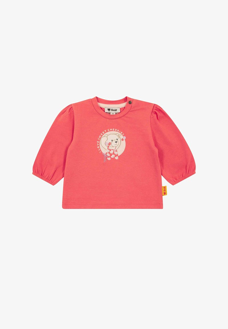 Haut corail en coton à manches longues bouffantes, avec un motif d'ours et le texte « J'aime les cerises sucrées », avec une étiquette logo sur le côté.