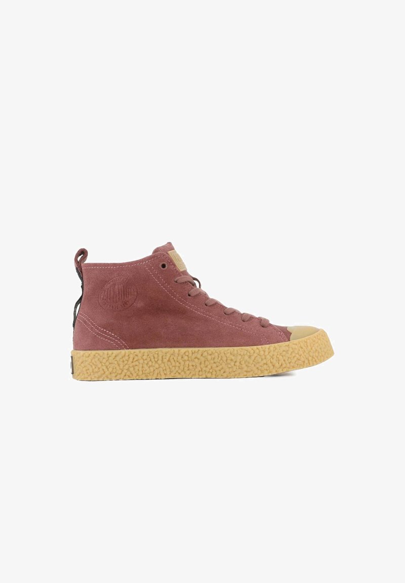 High-top sneakers made of pink suede with a textured beige rubber sole, featuring a logo patch and black pull tab.