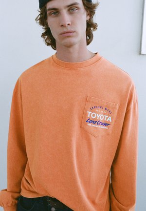 Top s dlhým rukávom - orange