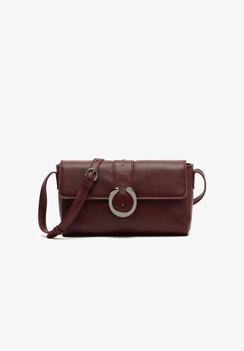 Burgundy faux leather crossbody bag with a flap closure, silver-toned circular hardware, decorative studs, and an adjustable strap.
