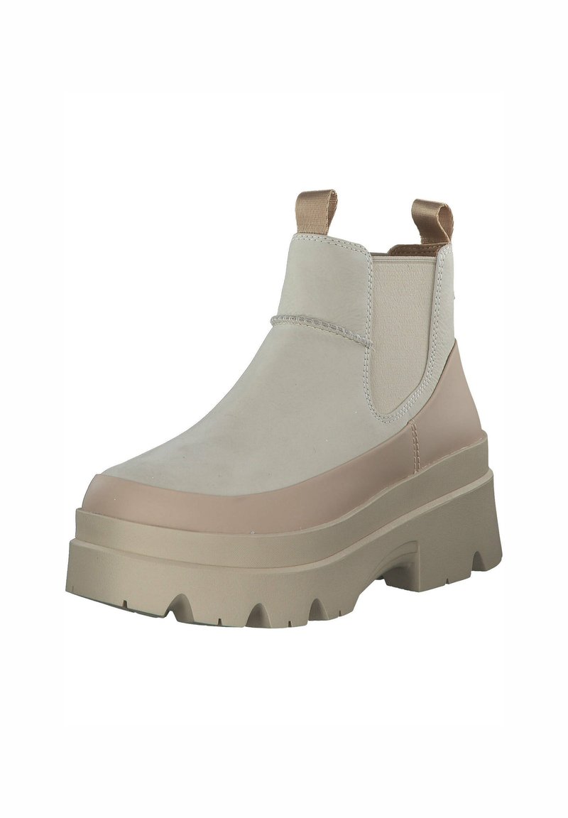 Beige Knöchelstiefel mit einem stabilen, strukturierten Obermaterial und einer massiven Gummisohle. Elastische Seitenpaneele und Zuglaschen für ein einfaches Anziehen.