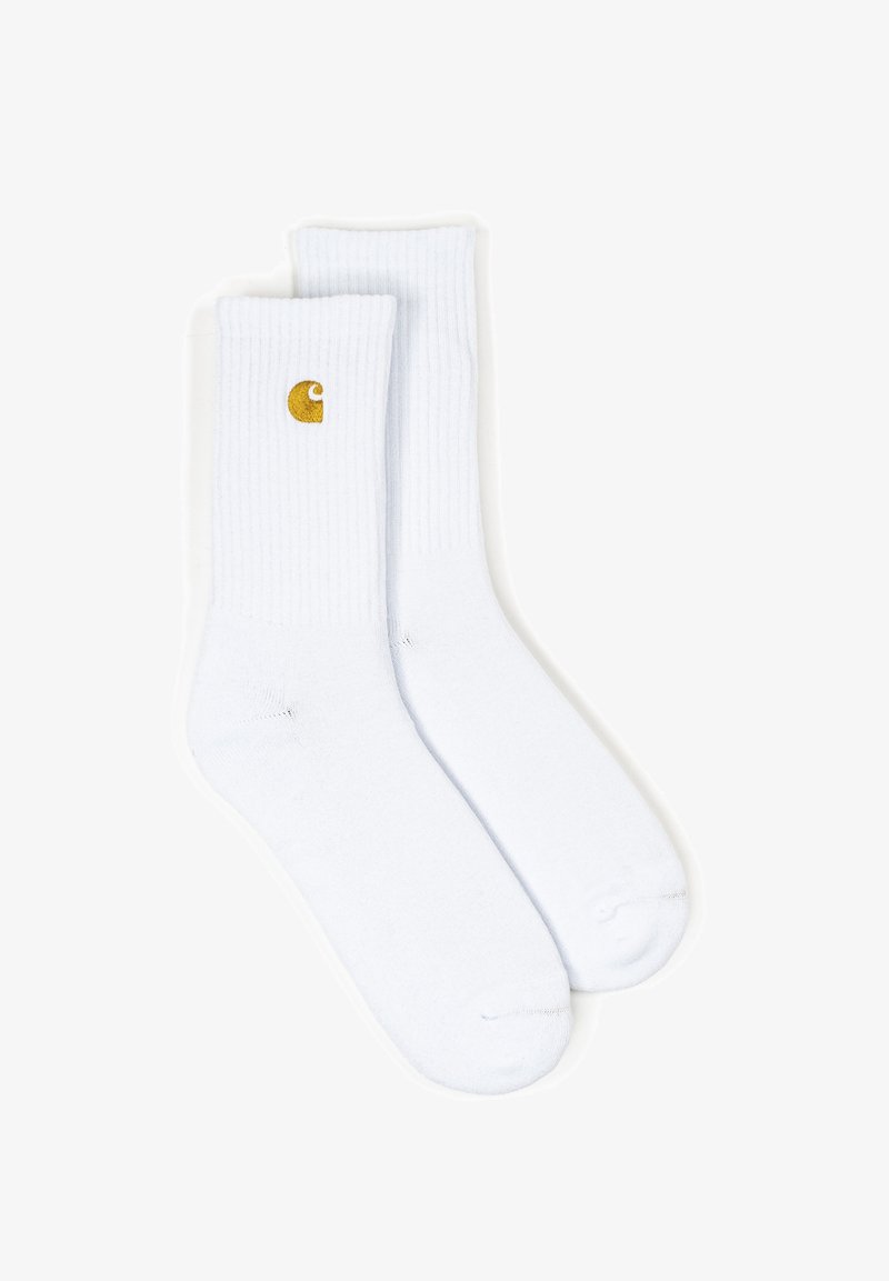 Valged puuvillased lühikesed sokid ribatekstuuriga, mille külje peale on broderitud väike kollane logo. Standardpikkus, pehme materjal.