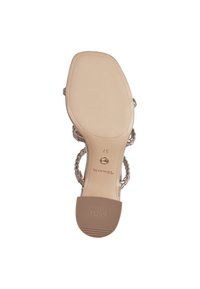 Sandale cu toc nude, cu curele împletite, talpă sintetică netedă și un fund texturat cu branding "ANTI SLIDE". Mărimea marcată ca 37.