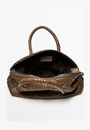 Brown woven leather handbag with top zipper closure and short handles. Interior is dark fabric, featuring a branded label.