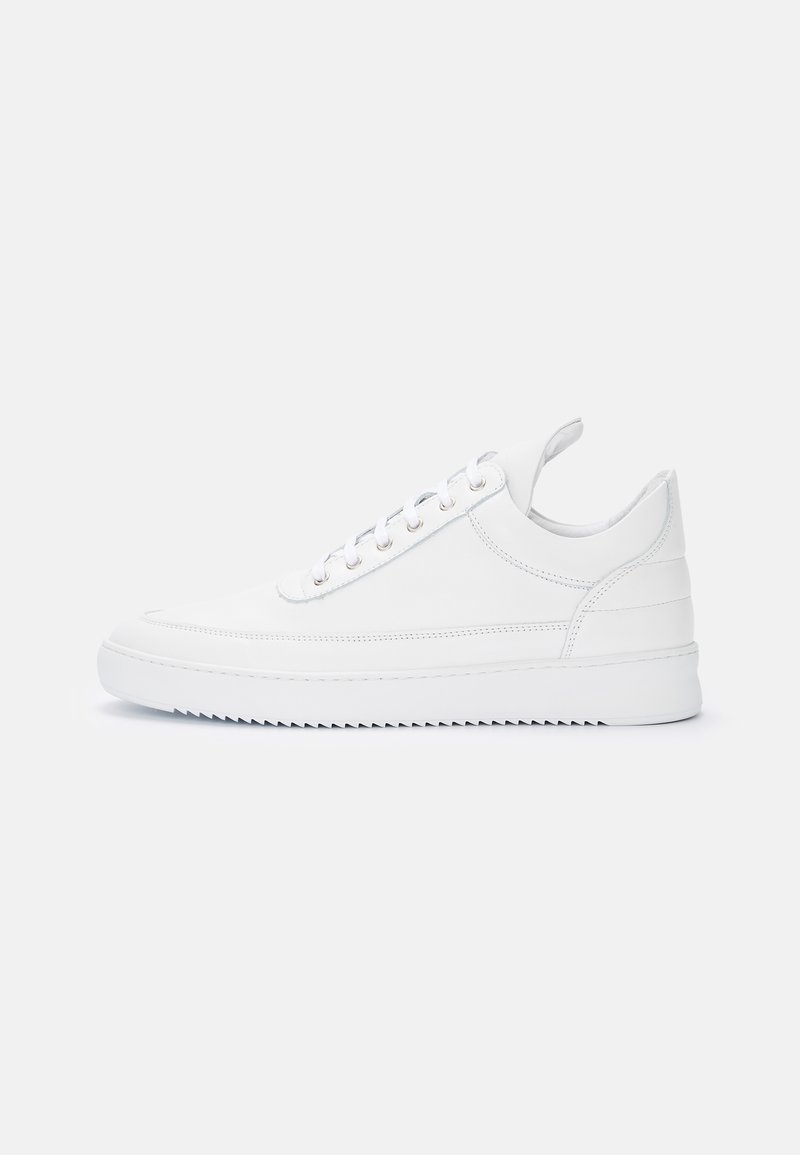 White leather sneakers with a smooth texture, rounded toe, and flat sole. Features silver eyelets and a minimalistic design.