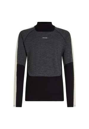 Suéter de manga larga negro y gris oscuro con cuello alto, rayas beige claro en las mangas y logo de "icebreaker" en el pecho.