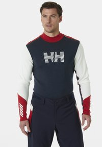 Marineblauwe, rode en witte longsleeve shirt met "HH" logo; aansluitend ontwerp; contrasterende schouders en mouwen; hoge kraag; gladde textuur.