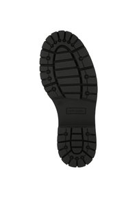 Semelle de botte en caoutchouc noir avec un motif de traction texturé, présentant de profondes rainures et des accents circulaires ; marquée d'un indicateur de taille (37).