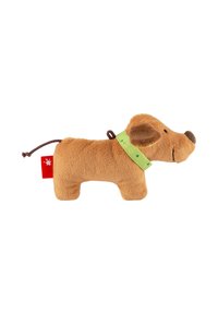 Small brown plush dog toy with floppy ears, green collar with dots, and a red tag near its tail on a white background.