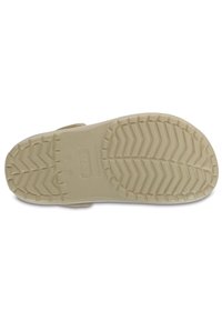 White rubber sandal sole with a zigzag pattern for grip, rounded edges, and a logo stamped in the center. Textured surface for traction.