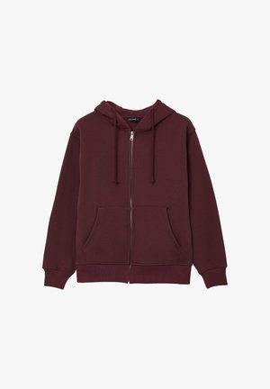 Felpa con zip color bordeaux, dotata di cappuccio con coulisse, tasche frontali, polsini e orlo a costine. Realizzata in tessuto morbido e testurizzato. Design semplice.