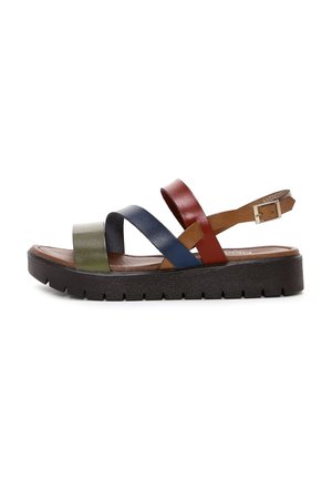 Multi-colored sandal featuring green, blue, red, and tan leather straps, a brown cushioned insole, and a thick black rubber sole.