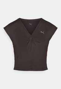 Svart trenings T-skjorte med V-hals og korte, korte ermer. Laget av glatt stoff med en sentral vridning. Har en liten Puma-logo.