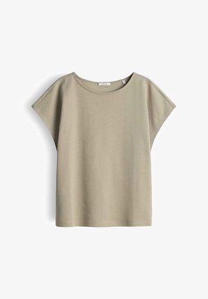 Beige losvallend dames T-shirt met korte mouwen, ronde halslijn en subtiele schoudercap-detail, gepresenteerd op een witte achtergrond.