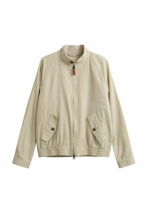 Veste zippée beige avec col montant, deux poches avant à boutons et ourlet élastique, présentée sur un fond blanc.