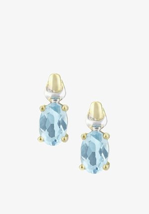 Ovaalse kujuga kõrvarõngad, millel on helerohelised lihvitud kalliskivid, seatud kuld- ja hõbemetalli lihtsa, elegantse disainiga.