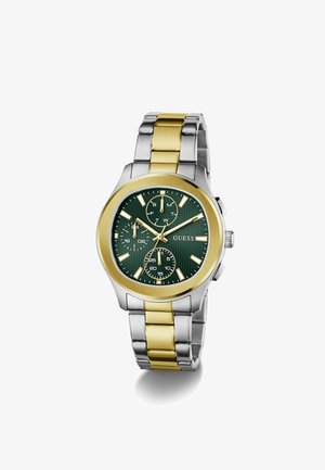 Montre-bracelet en métal bi-tone argent et or avec cadran vert, trois sous-cadrans, index dorés et le nom de la marque GUESS sur le cadran.