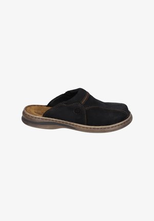 Scarpa nera in pelle senza lacci con punta arrotondata, cuciture marroni a contrasto, soletta imbottita e suola flessibile di colore marrone chiaro.