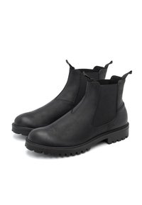 Botas Chelsea negras de cuero suave con paneles laterales elásticos, tiradores y una suela de goma gruesa con dibujo para agarre.
