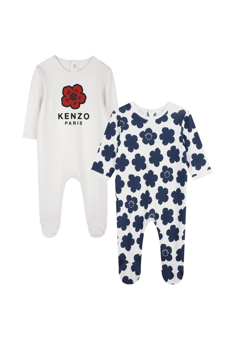 Deux bodies pour bébé : l'un est blanc avec un logo de fleur rouge et du texte noir, l'autre est blanc avec un motif floral bleu marine. Les deux ont des manches longues.