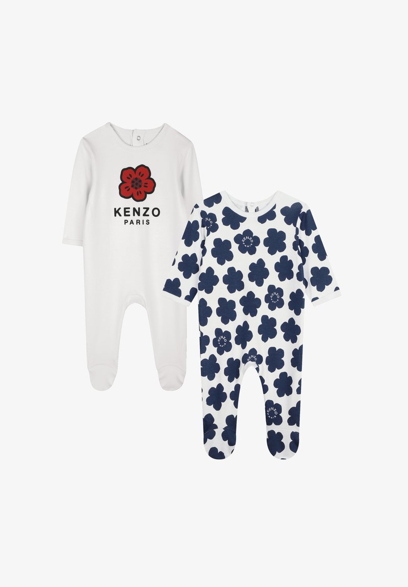 Deux bodies pour bébé : l'un est blanc avec un logo de fleur rouge et du texte noir, l'autre est blanc avec un motif floral bleu marine. Les deux ont des manches longues.
