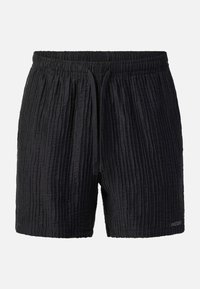 Short en tissu texturé noir avec ceinture élastique et cordon devant, présenté sur un fond clair uni.