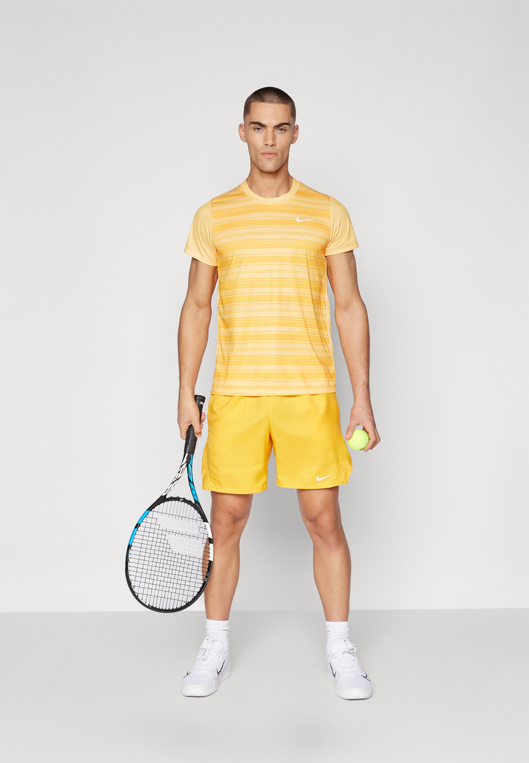 yellow nike tennis shirt
