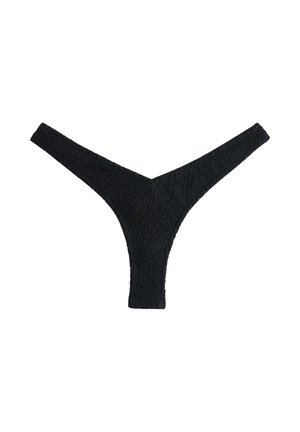 String en tissu noir texturé avec un devant étroit et une ceinture plus large, posé à plat sur un fond blanc.