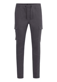 Grijze joggerbroek met elastische tailleband, trekkoord, zijzakken en taps toelopende pijpen. Gemaakt van zachte katoenen stof met een soepele textuur.