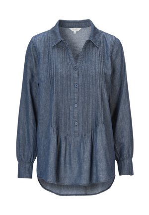 Jeansskjorta i mörkblått, med knäppning fram, V-hals och veckdetaljer. Har långa ärmar med manschetter och en rundad fåll.