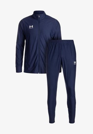 Navy tracksuit in polyester, featuring a zip-up jacket with long sleeves and elastic waistband pants. Includes white logo accents.
