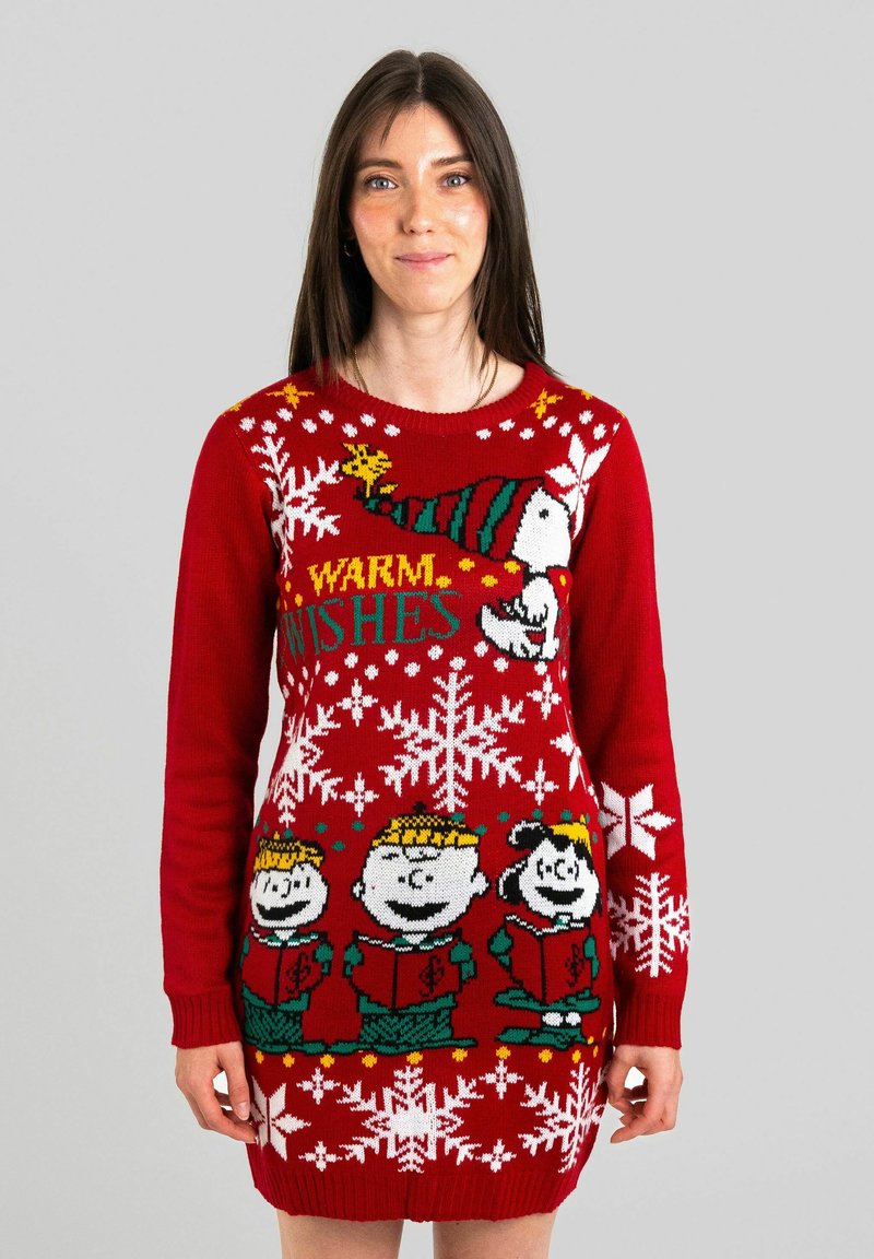 Maglione rosso lavorato a maglia con fiocchi di neve, personaggi dei cartoni animati che cantano e la scritta "WARM WISHES" in giallo. Maniche lunghe e polsini a coste.