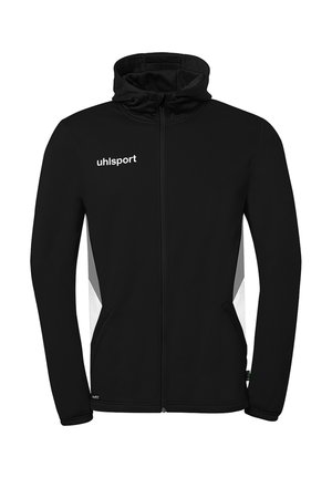Zwarte sportjas met ritssluiting en capuchon, wit "uhlsport" logo op de borst, en witte en grijze zijpanelen.