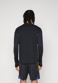 adidas Performance MANCHESTER UNITED 25/26 EUROPEAN PRO TRAINING TOP - Φανέλα τερματοφύλακα - black/blue/tribe yellow