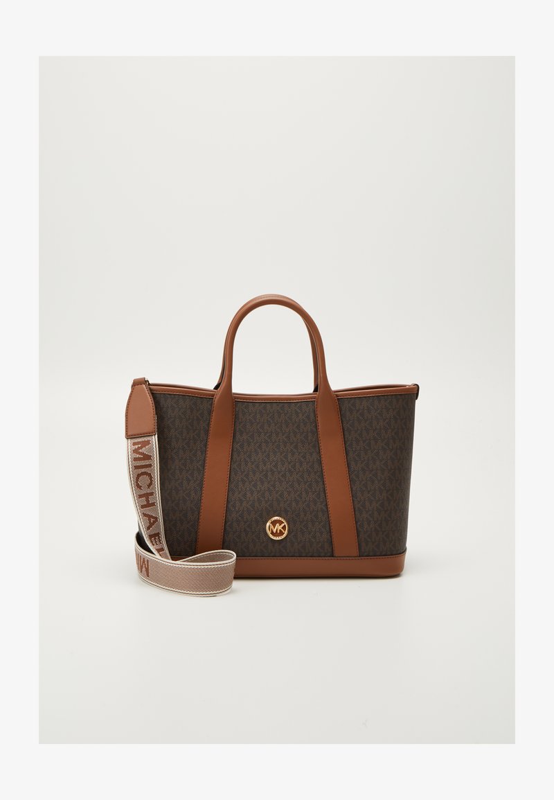 Brown monogram tote bag with tan leather accents, dual top handles, and a detachable strap featuring "MICHAEL" in repeating pattern.