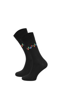 Czarne bawełniane skarpetki z kolorowym wzorem warzyw wokół mankietu. Gładka faktura i dopasowanie zapewniające komfort.