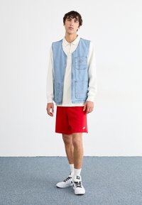 Nike Sportswear Pantaloni de trening - university red/white