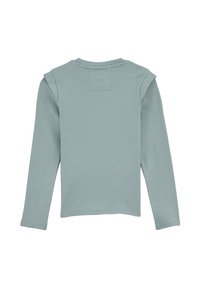 Chemise à manches longues en tissu côtelé vert clair, avec un col rond et un détail aux épaules. Texture lisse sans motifs visibles.