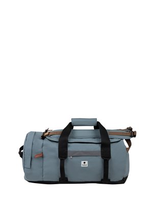 Light blue duffel bag with black handles, adjustable shoulder strap, side pocket, and a small front logo patch.