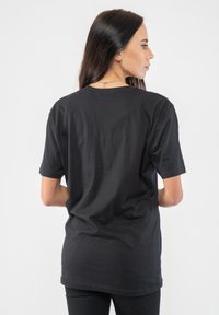 Paradiso Clothing THE ROLLING STONES SIXTY RAINBOW TONGUE 1962 PUFF  - Print T-shirt - black