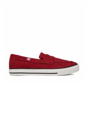 Red suede slip-on loafer with white rubber sole and black stripe, featuring a small white logo tag on the side.