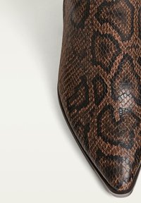 Pointed-toe ankle boot in brown and black faux snake skin with a textured pattern and smooth finish, featuring a narrow heel and sleek design.